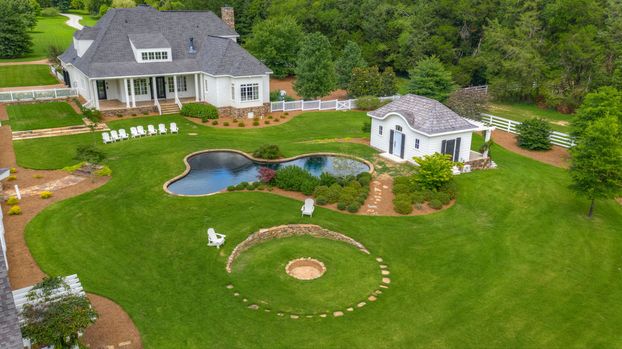 aerial view of acres house and green lanscaping